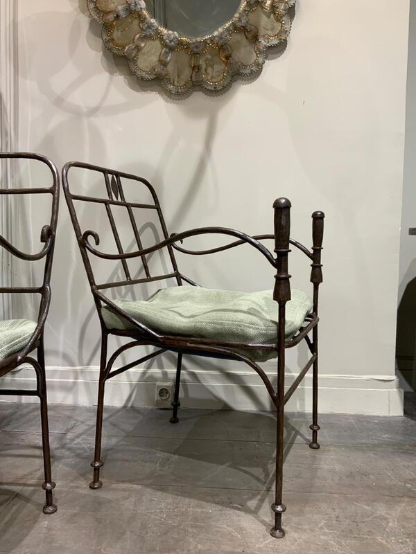 Pair of wrought iron armchairs 