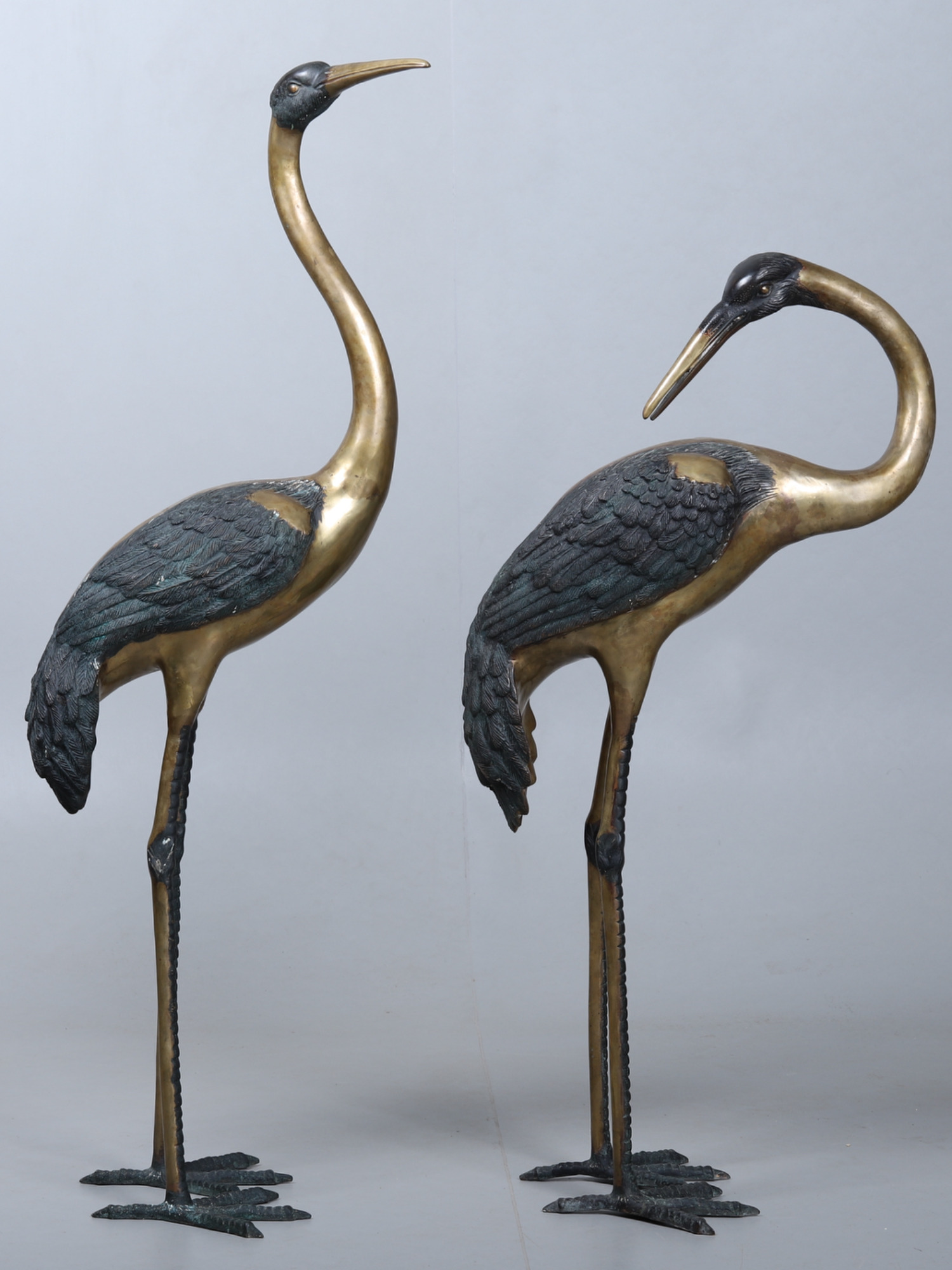 Pair of brass cranes circa 1970