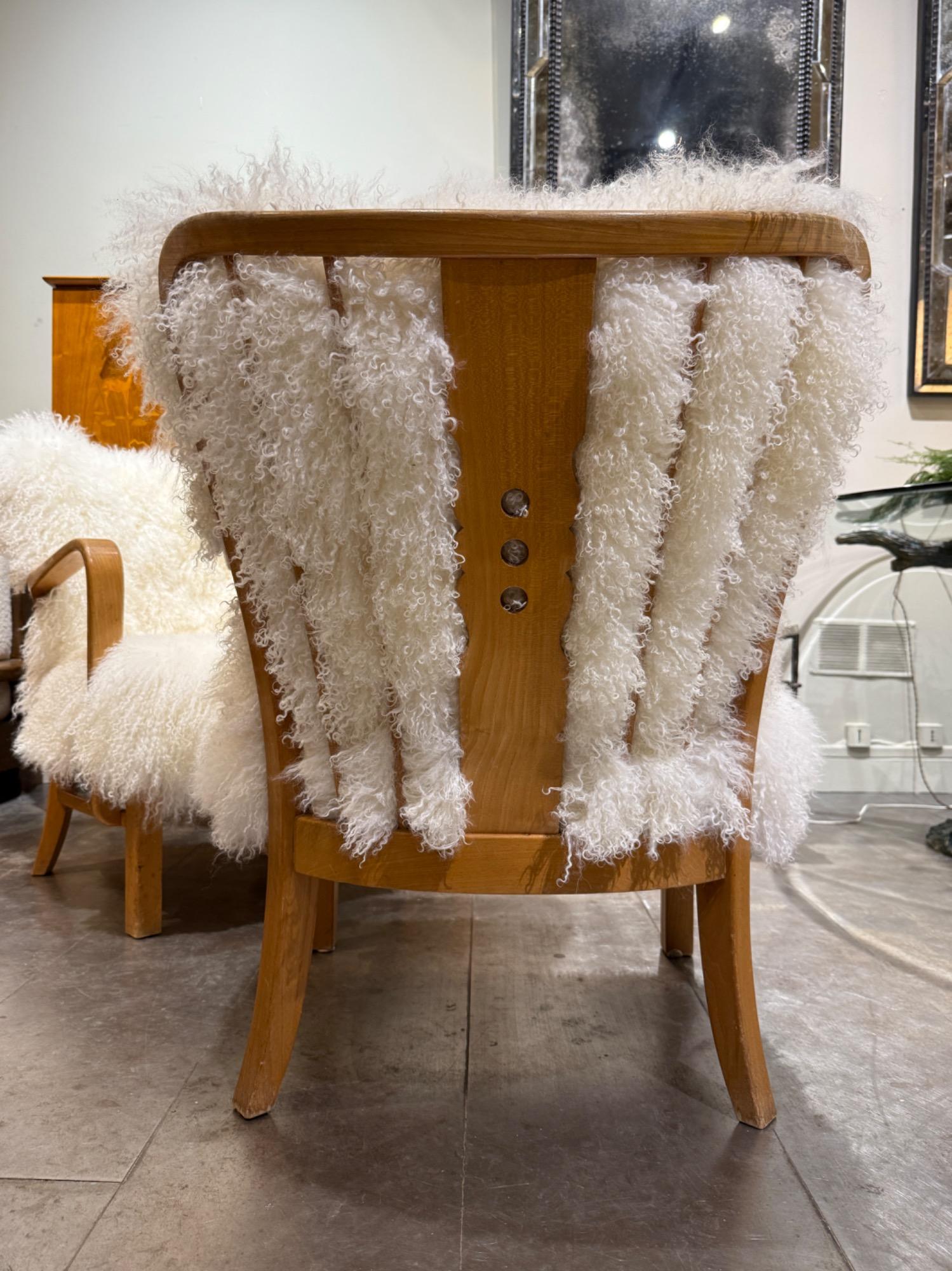 Pair of F Hansen armchairs circa 1940 with sheepskin cushions 